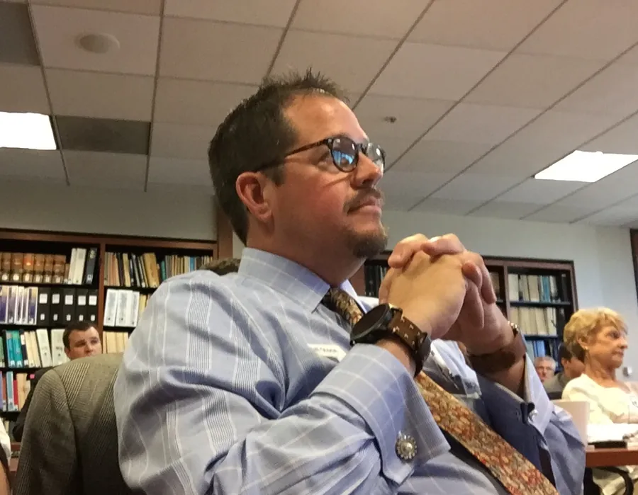 Randall Stone listening during a public policy discussion